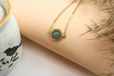 Golden Wheel Bracelet with Blue Stones
